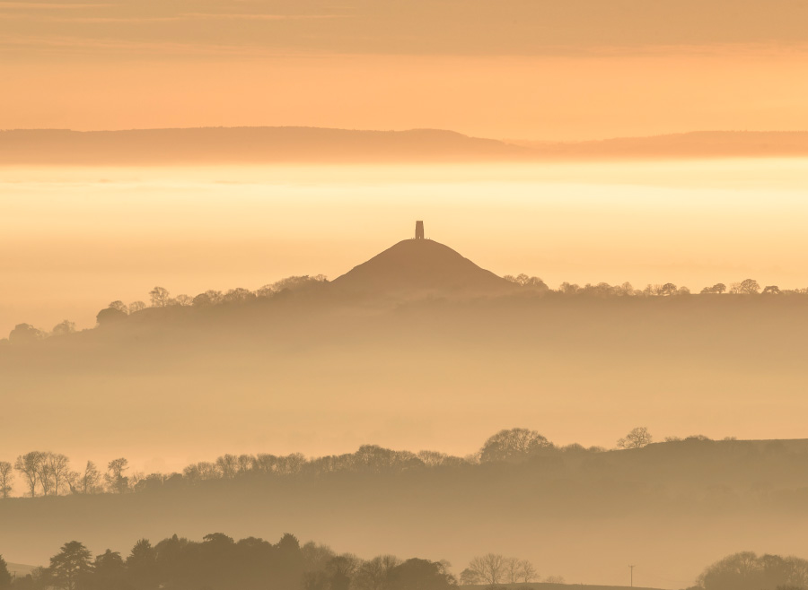 Glastonbury Tor at sunset on a foggy afternoon